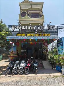 a group of motorcycles parked in front of a restaurant at Good Day Kampot Guesthouse in Kampot