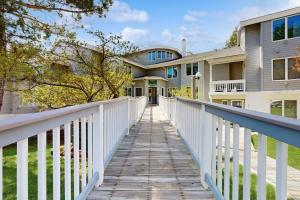 a boardwalk leading to a house with a white fence at Paradise in Vermont in Warren