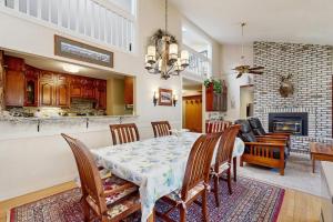 a dining room with a table and chairs and a fireplace at Paradise in Vermont in Warren