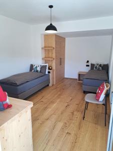 a living room with a bed and a couch at Casa Bassanello in Candide
