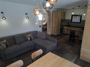 a living room with a couch and a table at Casa Bassanello in Candide