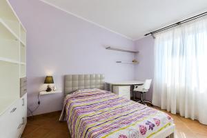 a bedroom with a bed and a desk and a window at Borgo Dragani in Ortona +47 photos