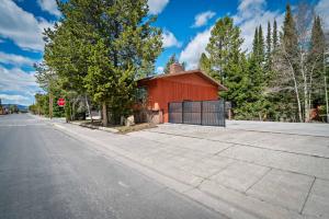 a red building on the side of a street at Geyser Getaway in West Yellowstone