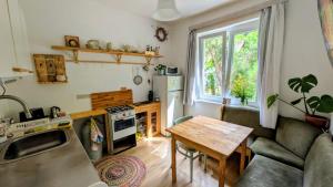 a living room with a couch and a table at Gesztenyés Backpackers in Kőszeg