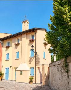 a large building with a tower on top of it at Casa Incanto - Agenzia Cocal in Caorle