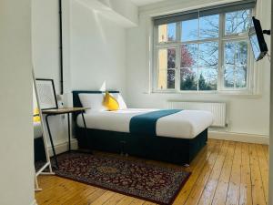 a bedroom with a bed and a window at Endsleigh Park Hotel in Hull +55 photos