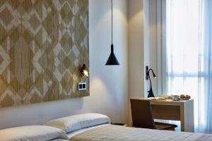 Łóżko lub łóżka w pokoju w obiekcie Hotel Bilbao Plaza