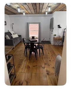 a living room with a table and a couch at Sleep at Simplicity in Massena