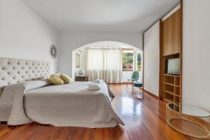 a white bedroom with a large bed and a window at Villa Thalissa by Perle di Puglia in Taranto +75 photos