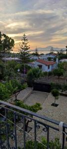 a view of a park with trees and buildings at aggelos home in Kato Alepochori