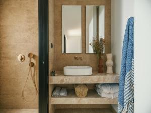 a bathroom with a sink and a mirror at Perla Del Mare in Alikanas +14 photos