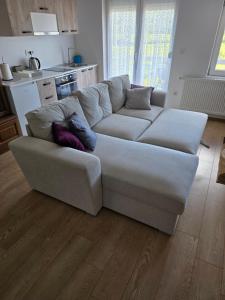 a white couch sitting in a living room at Lily 1 in Ljubuški +10 photos