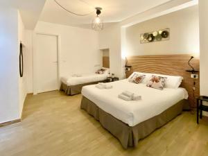 a bedroom with two beds in a room at Tao House in Taormina