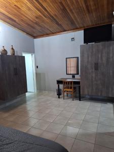 a room with a desk and a table with a chair at 14a on Middle Way in Tzaneen