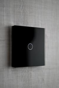 a black object with a button on a wall at Ana Central Studio in Smederevo