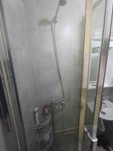 a shower with a glass door in a bathroom at Montenegro Mountain Retreat in Podgorica +14 photos