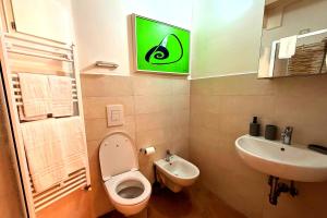 a bathroom with a toilet and a sink at Your Charming Amantea Getaway in Amantea
