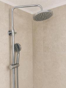 a shower with a shower head in a bathroom at Pinetree House in Nafplio +4 photos