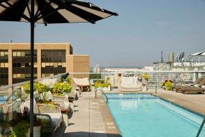 a swimming pool on the roof of a building at Halcyon, a hotel in Cherry Creek, Denver in Denver