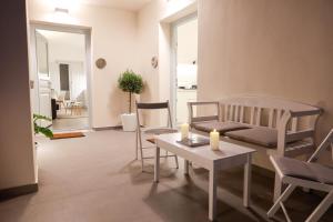 a living room with a couch and a table and chairs at Stay Lux Suites in Karterados