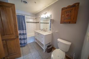 a bathroom with a white toilet and a sink at Springs 8806 by SummitCove Lodging in Colorado in Keystone