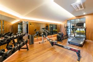 a gym with several treadmills and cardio machines at TURIM Lisboa Hotel in Lisbon