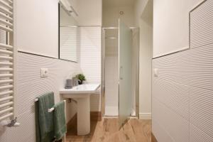 a bathroom with a sink and a shower at B&B Ago e Luce - YourPlace Abruzzo in Vasto +36 photos