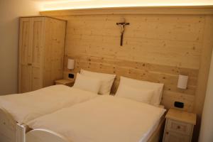 Un pat sau paturi într-o cameră la La Lum De Roisc