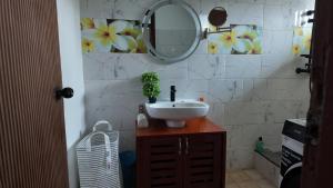 a bathroom with a sink and a mirror at 'Belkaz in Port-Gentil