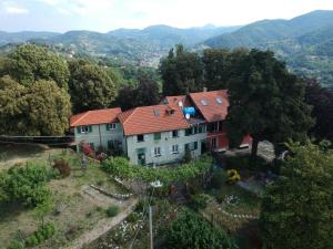 an aerial view of a house with mountains in the background at Villa Ponzio in Genoa