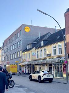 a police car parked on the side of a city street at HIAMO Hotel Hamburg-Bergedorf in Hamburg