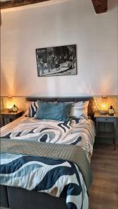 a bedroom with a bed and two night tables with lights at Casa Enzo in Besozzo