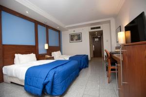 Voodi või voodid majutusasutuse Eko Hotel Main Building toas