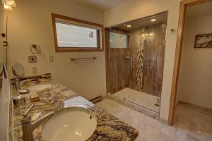 a bathroom with a sink and a shower at Ski Run 201 by SummitCove Lodging in Colorado in Keystone +27 photos
