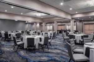 a banquet room with white tables and chairs at Fairfield Inn & Suites by Marriott Charlotte Uptown in Charlotte +36 photos
