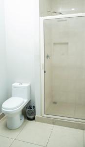 a bathroom with a toilet and a shower at Hotel Tampico Express in Ciudad Madero +55 photos