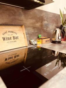 a table with a wine bar sign on top of it at Apartmán GREEN in Vysoké Mýto