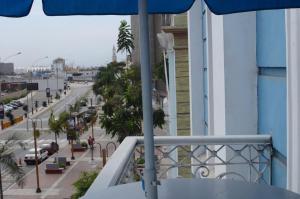 a balcony with a view of a street and a city at Hotel Acropolis Callao in Lima