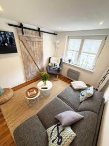 a living room with a couch and a chair at Fischerhus in Fehmarn