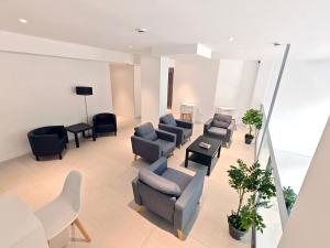 a living room with couches and chairs at HOTEL BESTPRICE Maragall in Barcelona