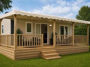 a house with a deck with a gazebo at Camping Cabestan in Bretignolles-sur-Mer