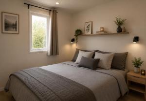 a bedroom with a large bed with a window at Camping Cabestan in Bretignolles-sur-Mer