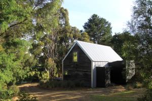 a black and white shed with a white roof at BIG.SHED.HOUSE in Huonville