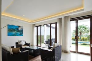 a living room with chairs and a table at Morning Glory Mountain View Villa 4 Bedrooms With a Private Heated Swimming Pool in Bandung