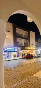 a building with a car parked in front of it at Apartment in recent residence in Monastir