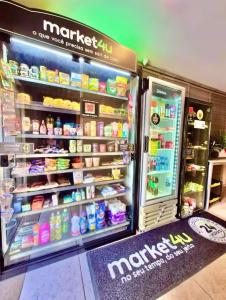a refrigerator filled with lots of food and drinks at 809 - Studio Moderno no Centro-Batel in Curitiba
