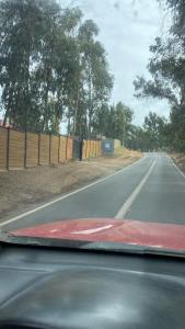 a view of a road from the windshield of a car at Ritoque lodge in Vina del Mar +13 photos