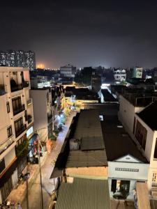a view of a city at night with buildings at Ngôi Nhà Mơ Ước in Ho Chi Minh City