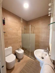 a bathroom with a toilet and a sink and a shower at andaluz in La Mamola
