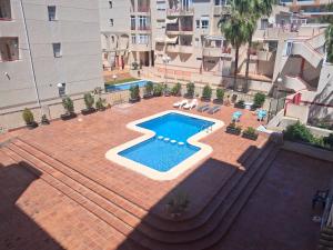 an overhead view of a swimming pool in a building at Albir Sunshine Apartments in Albir